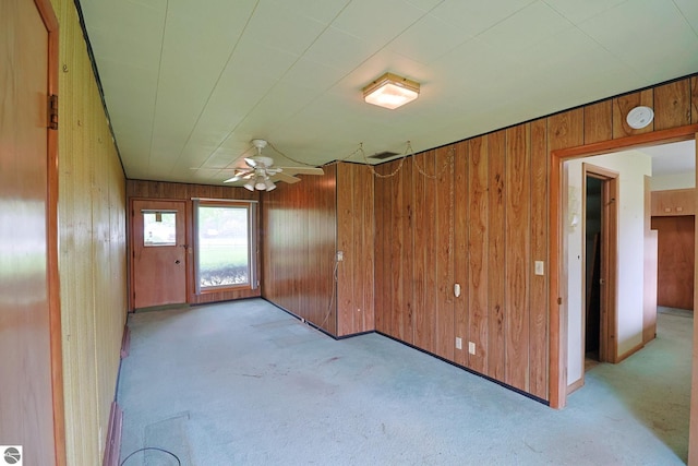 8670 E Pickard Rd, Mount Pleasant, MI 48858 - carpeted spare room with wood walls, ceiling fan, and a smoke detector
