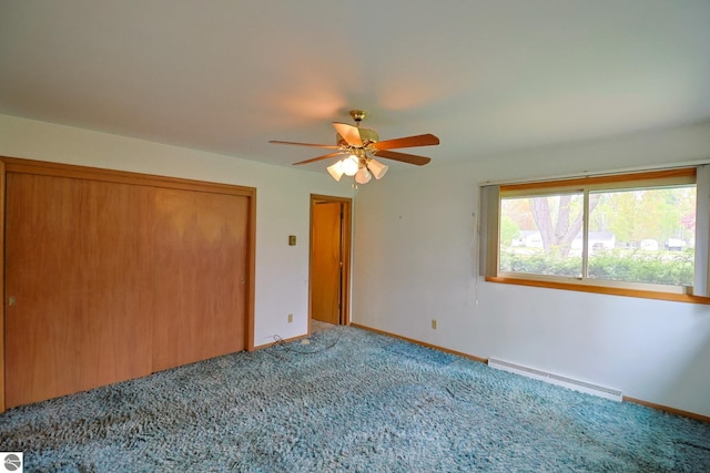 8670 E Pickard Rd, Mount Pleasant, MI 48858 - unfurnished bedroom with a baseboard heating unit, carpet flooring, a closet, and baseboards