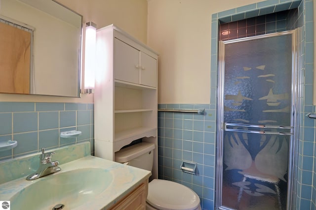 8670 E Pickard Rd, Mount Pleasant, MI 48858 - full bathroom with tile walls, a stall shower, toilet, and vanity
