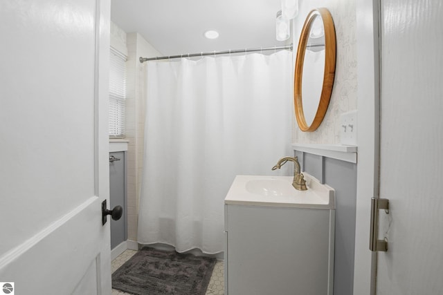 full bath featuring vanity and shower / bathtub combination with curtain