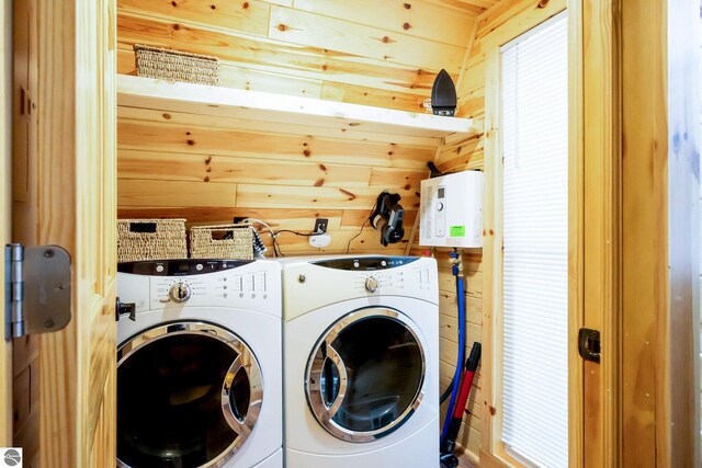 1428 Morel Ln, Grayling, MI 49738 - laundry area featuring washer and clothes dryer and wood walls