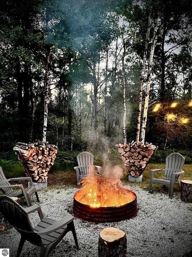 1428 Morel Ln, Grayling, MI 49738 - view of patio / terrace featuring a fire pit