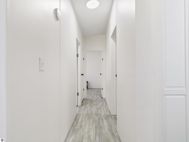 hallway with light wood finished floors