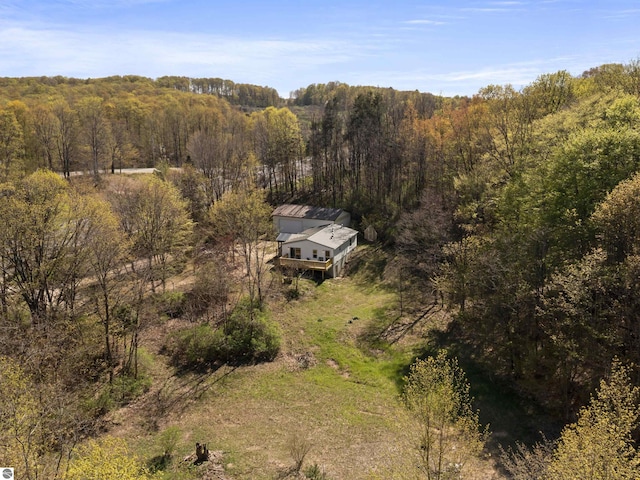 view from above of property with a forest