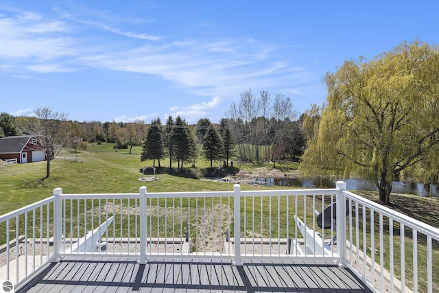 3121 Grace Rd, Frankfort, MI 49635 - deck featuring a water view and a yard