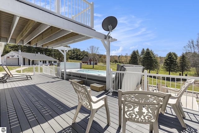3121 Grace Rd, Frankfort, MI 49635 - wooden terrace featuring an outbuilding, a storage shed, and view of wooded area