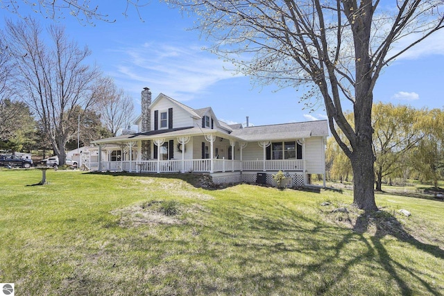 3121 Grace Rd, Frankfort, MI 49635 - farmhouse-style home featuring a porch, a chimney, and a front lawn