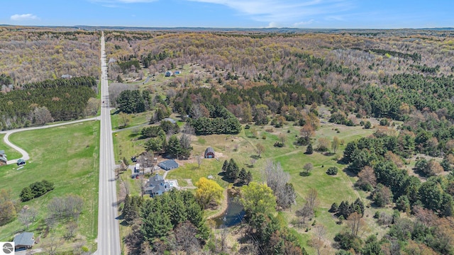 3121 Grace Rd, Frankfort, MI 49635 - aerial view of property and surrounding area with a heavily wooded area