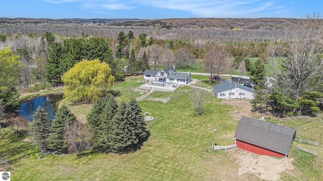 3121 Grace Rd, Frankfort, MI 49635 - aerial view of property and surrounding area with a forest and a large body of water