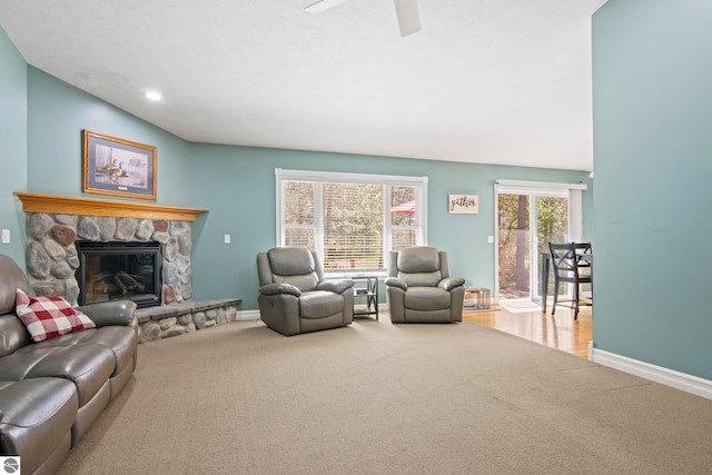 8256 Mapleleaf Dr, Traverse City, MI 49684 - carpeted living room with baseboards, a fireplace, ceiling fan, and recessed lighting
