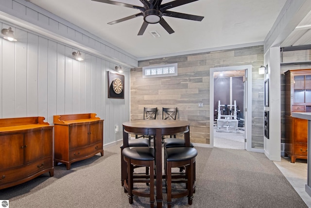 8256 Mapleleaf Dr, Traverse City, MI 49684 - dining room with carpet, a ceiling fan, baseboards, and crown molding
