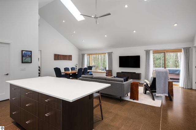 20651 E Trails End Trl, Interlochen, MI 49643 - kitchen with high vaulted ceiling, a skylight, healthy amount of natural light, modern cabinets, and light countertops
