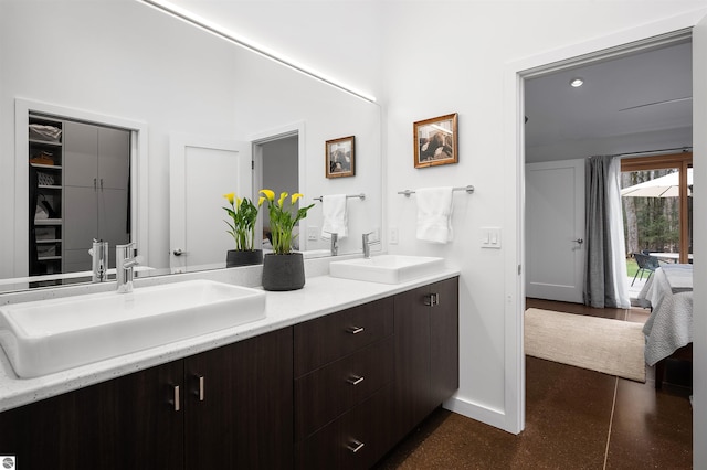 20651 E Trails End Trl, Interlochen, MI 49643 - ensuite bathroom with double vanity and baseboards