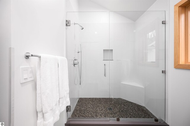 20651 E Trails End Trl, Interlochen, MI 49643 - full bath with a shower stall and vaulted ceiling