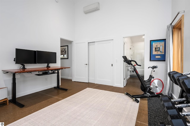 20651 E Trails End Trl, Interlochen, MI 49643 - workout area with a high ceiling and baseboards