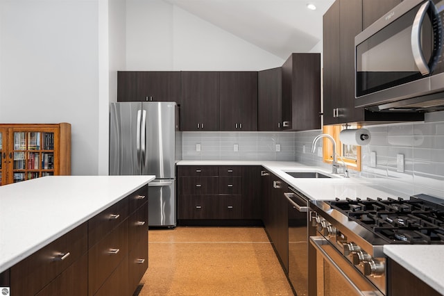 20651 E Trails End Trl, Interlochen, MI 49643 - kitchen featuring appliances with stainless steel finishes, a sink, light countertops, backsplash, and dark brown cabinets