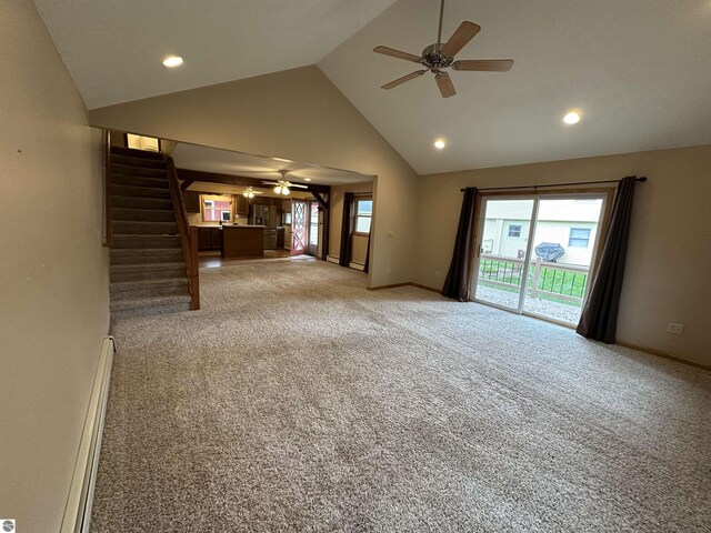 unfurnished living room with a ceiling fan, stairway, carpet flooring, high vaulted ceiling, and baseboards