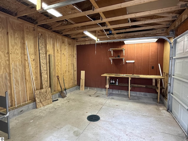 garage with a workshop area