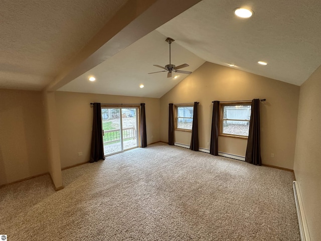 spare room with ceiling fan, lofted ceiling, light colored carpet, baseboard heating, and a baseboard radiator