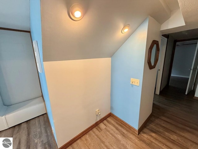 1411 N Dr, Mount Pleasant, MI 48858 - bonus room featuring wood finished floors, baseboards, and vaulted ceiling