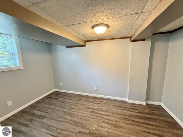 1411 N Dr, Mount Pleasant, MI 48858 - below grade area with wood finished floors, a paneled ceiling, and baseboards
