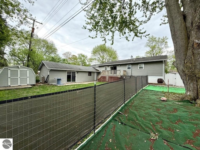 1411 N Dr, Mount Pleasant, MI 48858 - view of yard with a storage unit and an outbuilding