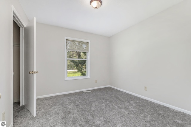7401 Red Maple Dr, Cadillac, MI 49601 - unfurnished bedroom featuring carpet flooring and baseboards