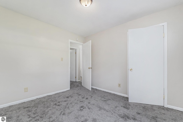 7401 Red Maple Dr, Cadillac, MI 49601 - carpeted spare room with baseboards