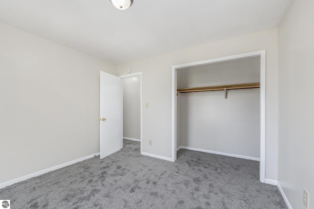 7401 Red Maple Dr, Cadillac, MI 49601 - unfurnished bedroom with carpet, a closet, and baseboards