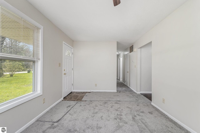 7401 Red Maple Dr, Cadillac, MI 49601 - unfurnished room with carpet flooring, healthy amount of natural light, and baseboards
