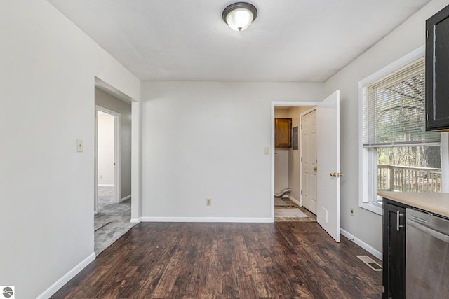 7401 Red Maple Dr, Cadillac, MI 49601 - empty room featuring dark wood-style floors and baseboards