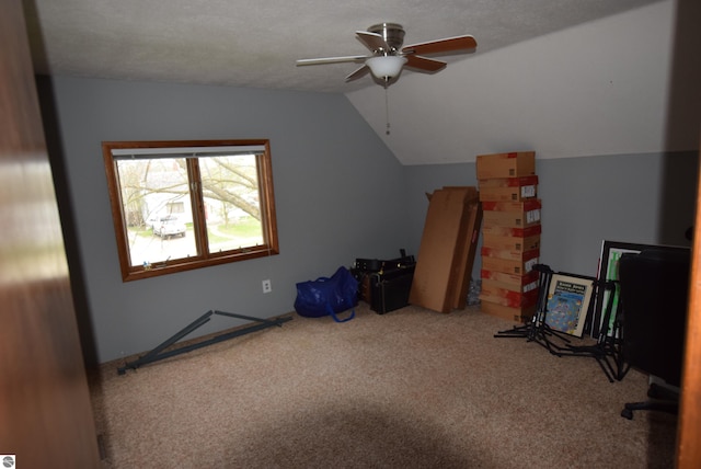 additional living space featuring lofted ceiling, carpet floors, and ceiling fan