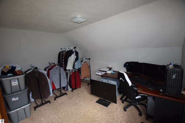home office with carpet and vaulted ceiling