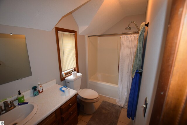 bathroom featuring lofted ceiling, tile patterned floors, toilet, vanity, and shower / bath combination with curtain