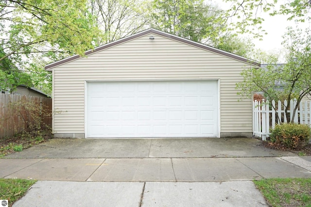 garage with fence