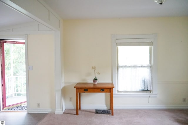 doorway to outside with carpet