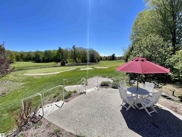 UNIT15 S Club Dr Unit 15, Cedar, MI 49621 - view of patio / terrace with view of golf course and outdoor dining space