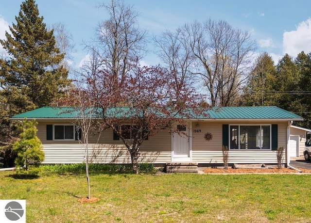 9869 E Cherry Bend Rd, Traverse City, MI 49684 - single story home with a front yard, metal roof, entry steps, and crawl space