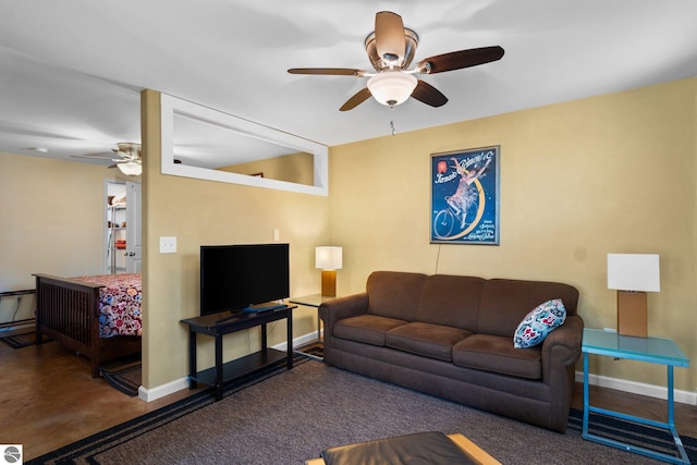 9869 E Cherry Bend Rd, Traverse City, MI 49684 - living room with a ceiling fan and baseboards