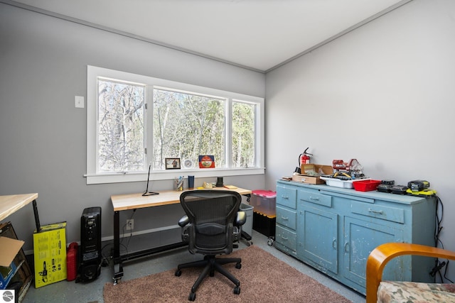 9869 E Cherry Bend Rd, Traverse City, MI 49684 - office area with concrete floors and baseboards