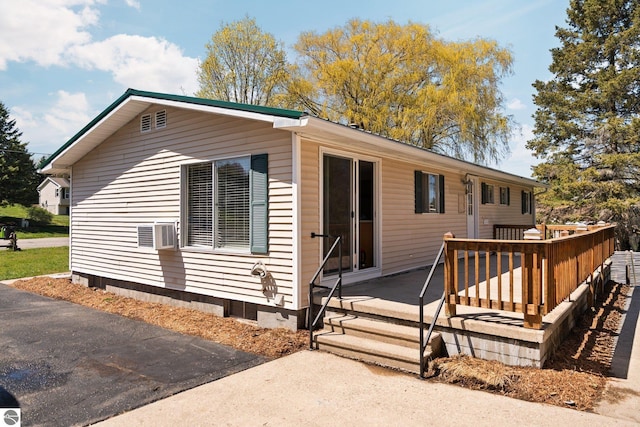 9869 E Cherry Bend Rd, Traverse City, MI 49684 - view of front of home with a wooden deck