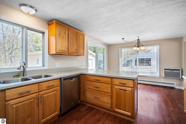 9869 E Cherry Bend Rd, Traverse City, MI 49684 - kitchen featuring stainless steel dishwasher, a sink, a baseboard radiator, a peninsula, and dark wood-style floors