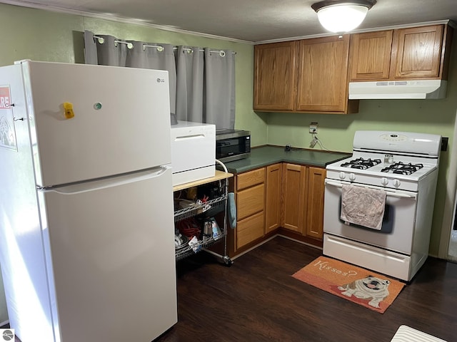 2214 Karen Dr, Saint Helen, MI 48656 - kitchen featuring white appliances, under cabinet range hood, dark wood-style floors, ornamental molding, and brown cabinetry