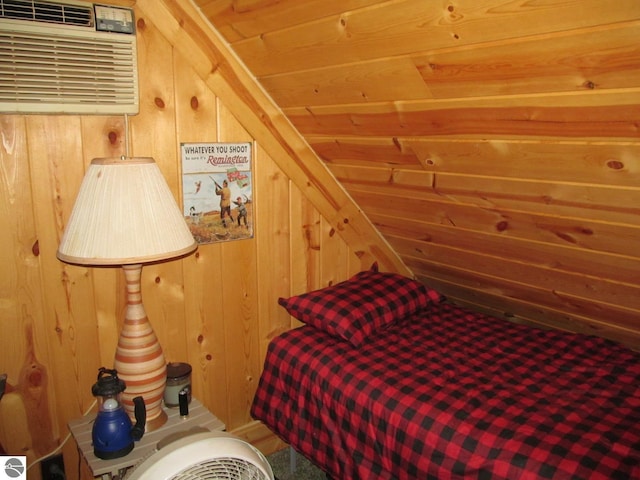 00 S 47 3/4 Rd, Cadillac, MI 49601 - bedroom with lofted ceiling, a wall mounted air conditioner, wood walls, and wooden ceiling