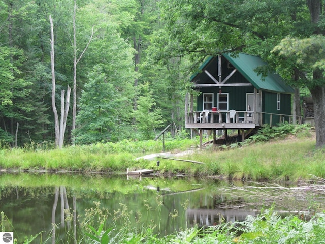 00 S 47 3/4 Rd, Cadillac, MI 49601 - view of front of house with a view of trees and a water view