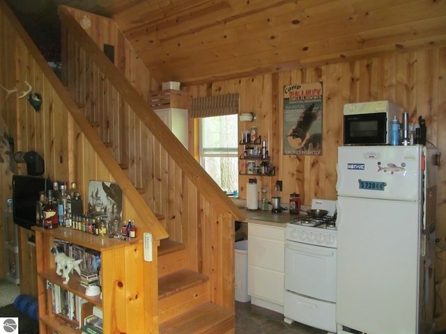 00 S 47 3/4 Rd, Cadillac, MI 49601 - staircase with wood walls and wood ceiling