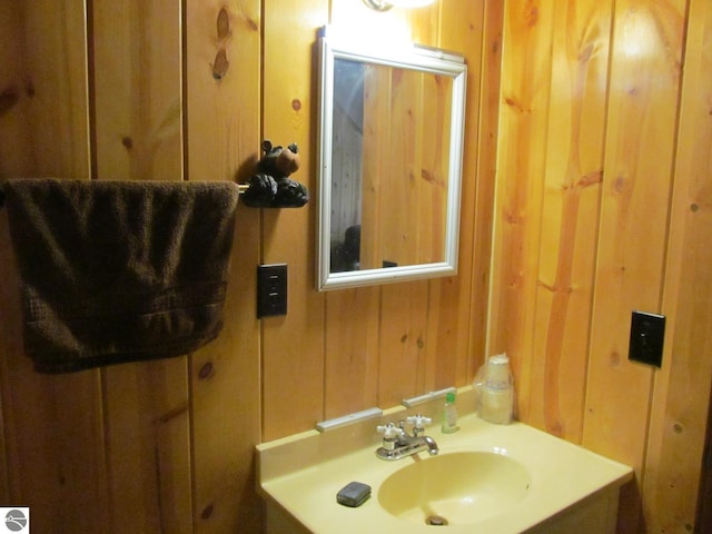 00 S 47 3/4 Rd, Cadillac, MI 49601 - bathroom featuring wood walls and vanity