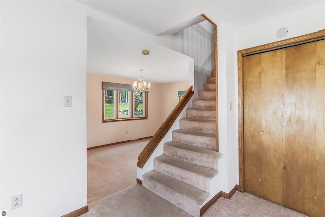 8377 Zosel St, Onekama, MI 49675 - stairs featuring carpet floors, a chandelier, and baseboards