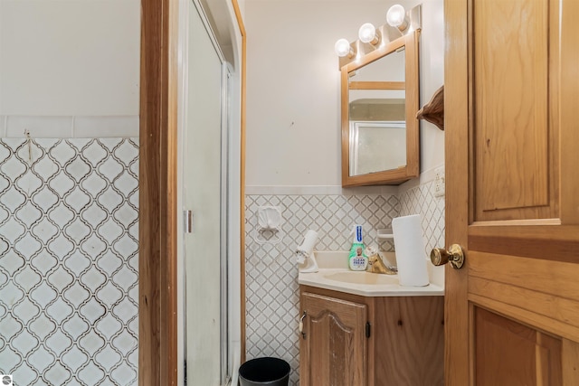 8377 Zosel St, Onekama, MI 49675 - full bathroom with tile walls, a wainscoted wall, vanity, and curtained shower