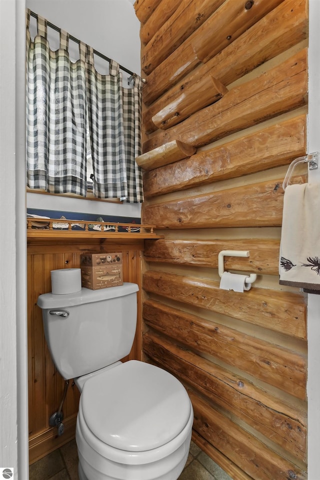 66 N Center St, Lake City, MI 49651 - bathroom featuring log walls and toilet